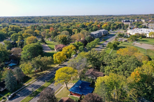 birds eye view of property with a wooded view