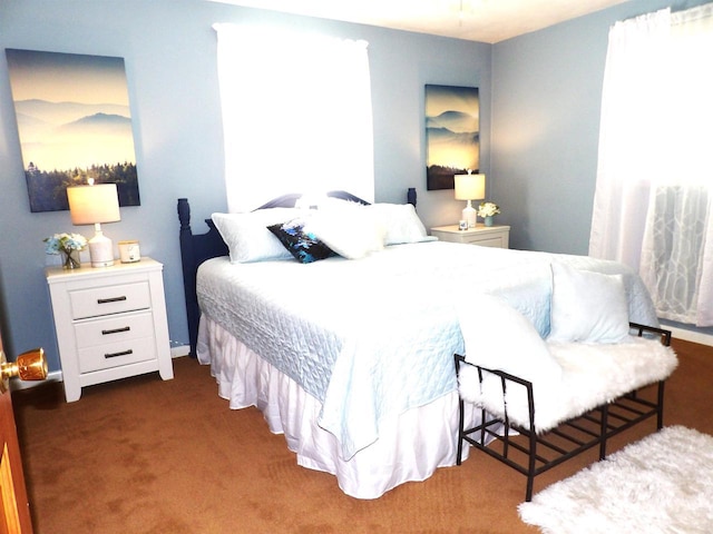 bedroom featuring dark colored carpet