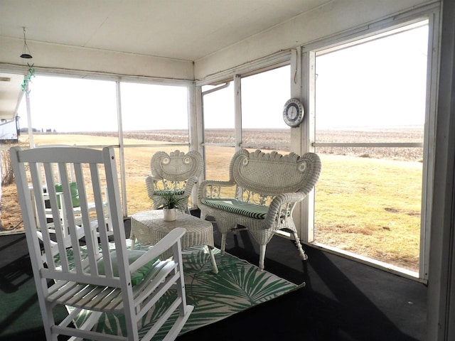 sunroom / solarium featuring a rural view