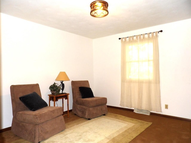 sitting room featuring visible vents and baseboards