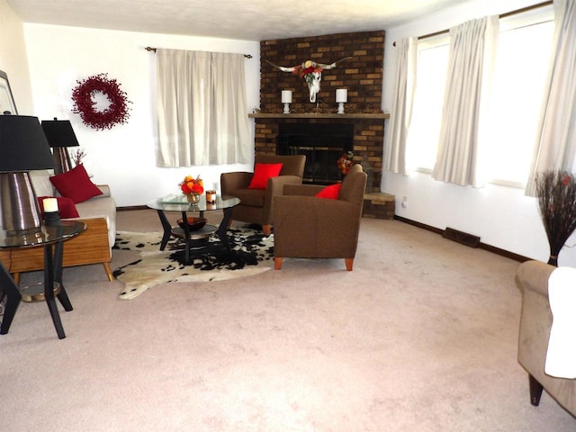 living room with baseboards, carpet, and a brick fireplace