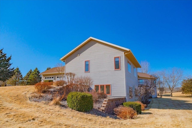 view of home's exterior with an attached garage