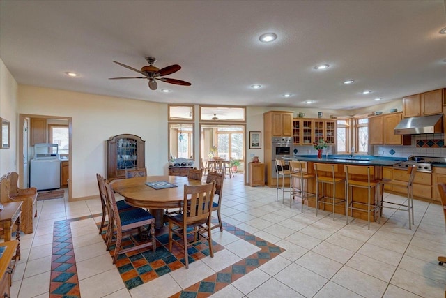 dining space featuring light tile patterned floors and a wealth of natural light