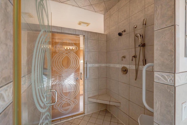 bathroom with tiled shower