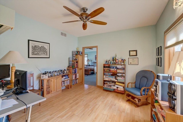 office area featuring visible vents, light wood-style flooring, and ceiling fan