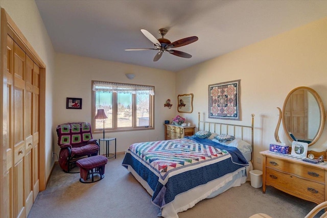 bedroom with carpet flooring, a closet, and ceiling fan