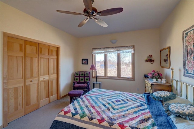 carpeted bedroom with a closet and ceiling fan