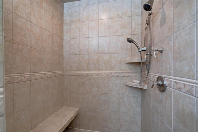 full bath featuring tiled shower