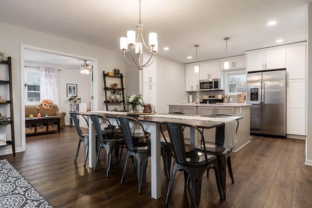 dining room with dark wood-type flooring, recessed lighting, and a ceiling fan