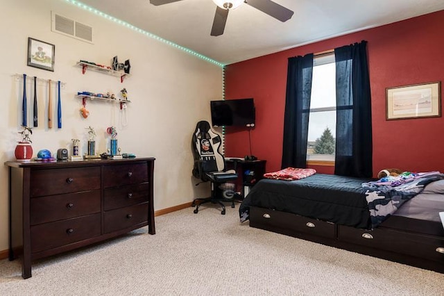 bedroom with a ceiling fan, visible vents, light carpet, and baseboards