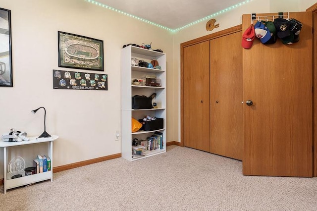 carpeted bedroom featuring baseboards