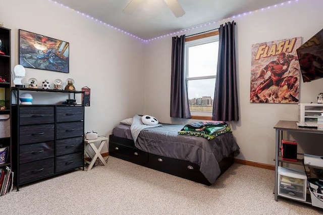 bedroom with carpet floors, baseboards, and a ceiling fan