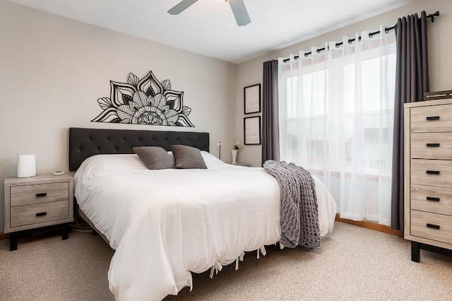 carpeted bedroom featuring a ceiling fan