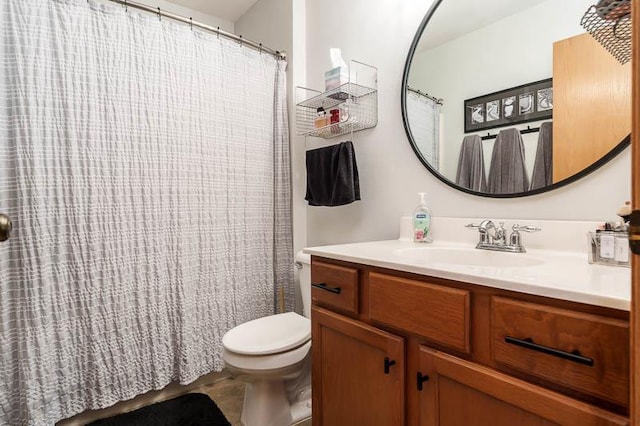 bathroom with vanity and toilet