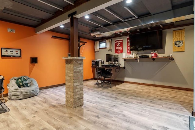 interior space featuring wood finished floors and baseboards