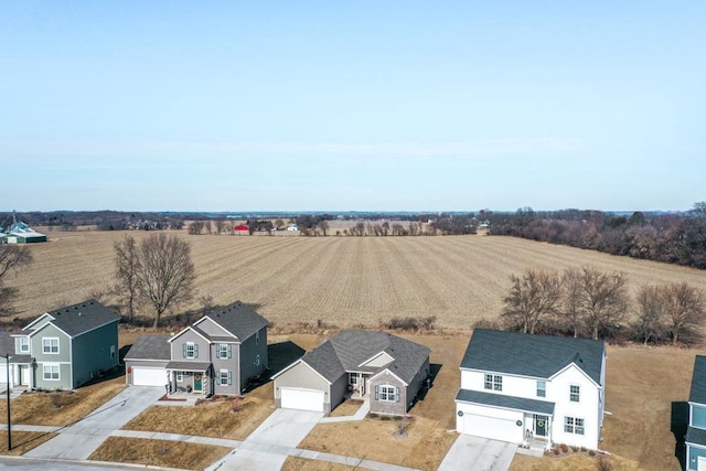 drone / aerial view with a rural view and a residential view