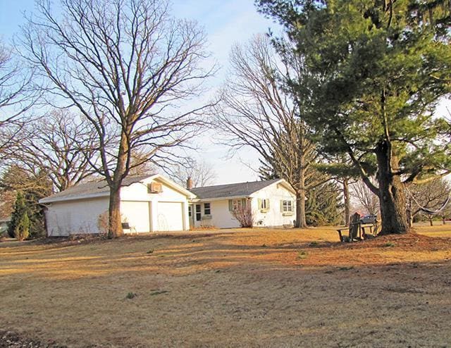 872 Northside Dr, Platteville, WI 53818 - ranch-style home featuring a garage and a chimney