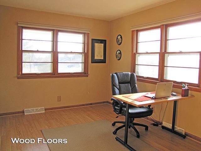 872 Northside Dr, Platteville, WI 53818 - office space featuring wood finished floors, visible vents, and baseboards