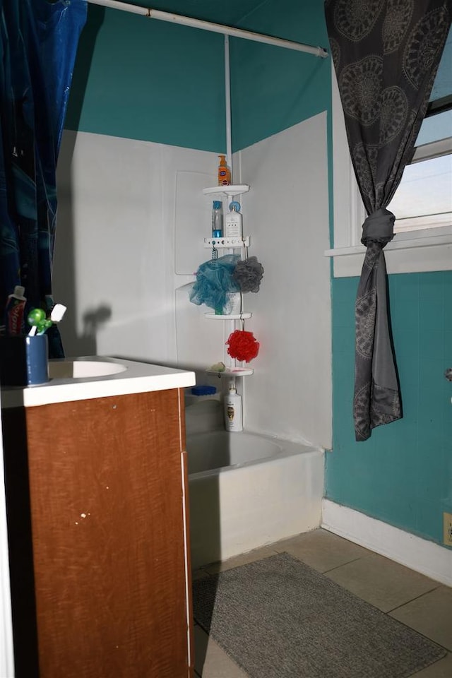 bathroom with tile patterned floors, shower / bathing tub combination, and vanity