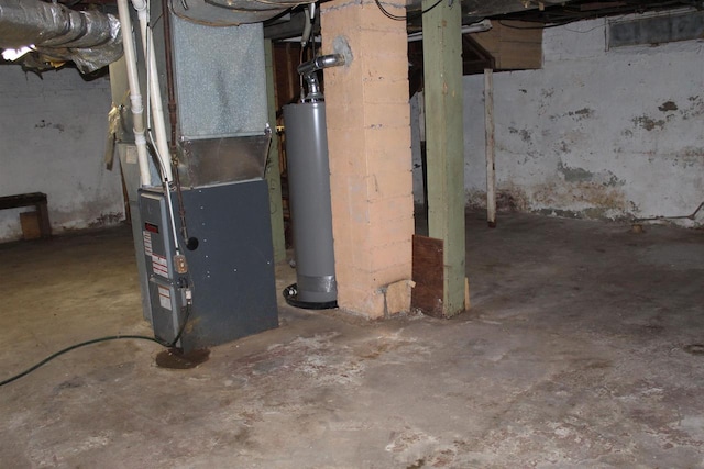 unfinished basement with gas water heater and heating unit