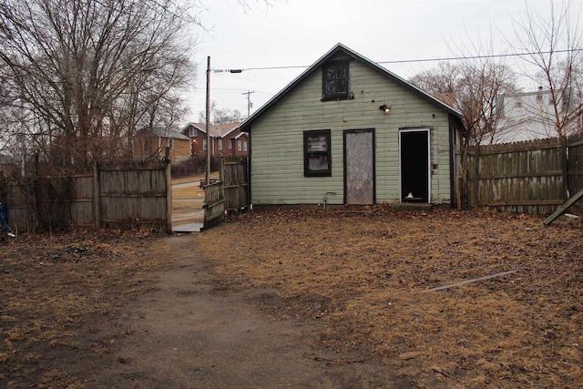 view of outbuilding with fence