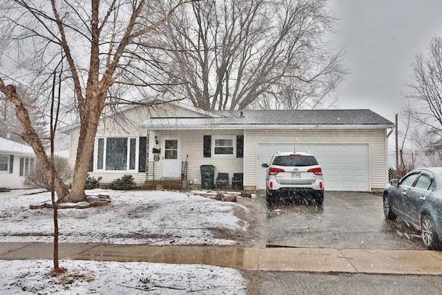 view of front of property with a garage and driveway