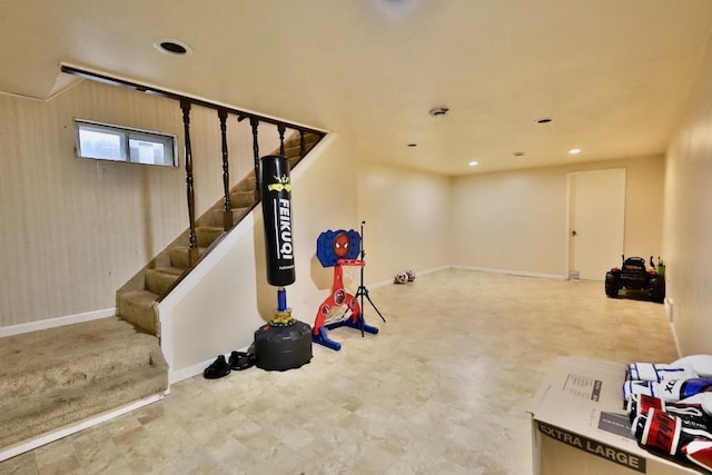 below grade area featuring baseboards, stairway, tile patterned floors, and recessed lighting