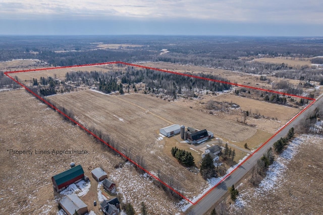 birds eye view of property featuring a rural view