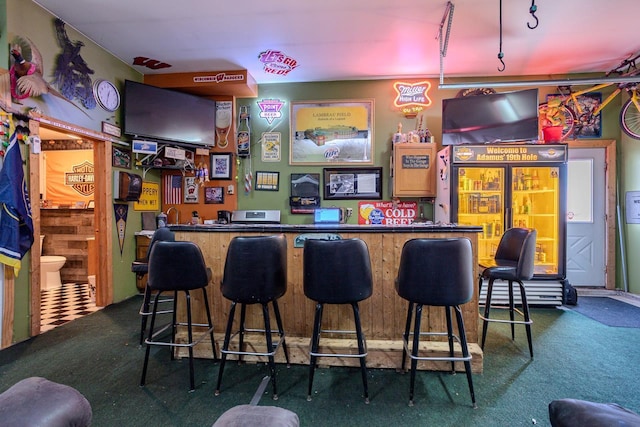 bar with carpet floors and indoor wet bar