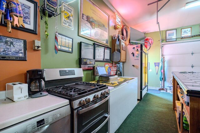 kitchen with carpet floors, stainless steel appliances, and light countertops