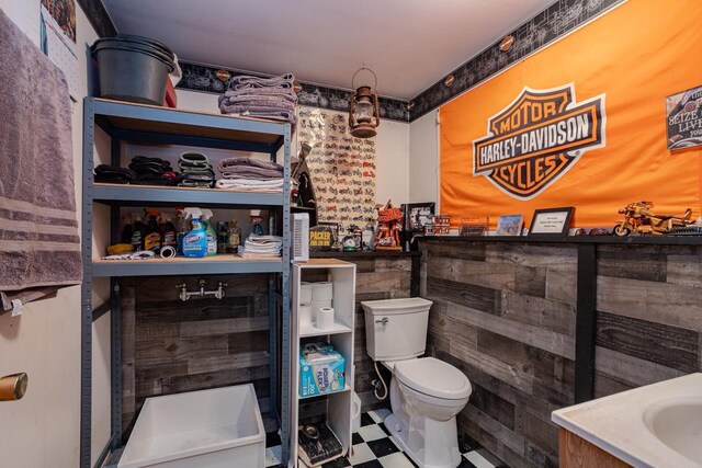 bathroom with toilet and tile patterned floors