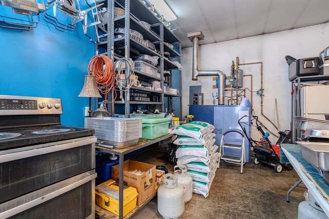 interior space with double oven range and concrete floors