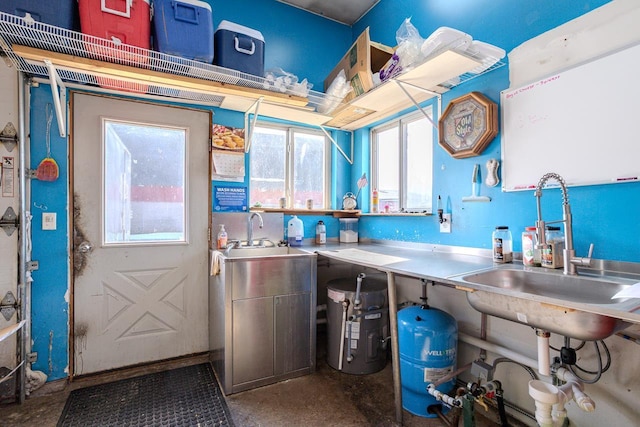 kitchen with concrete flooring and a sink