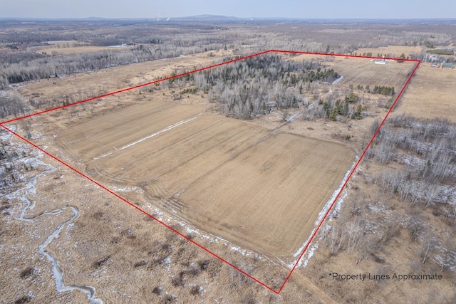 birds eye view of property with a rural view