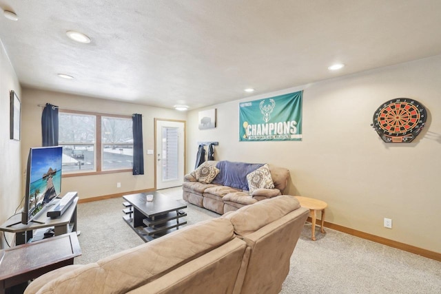 carpeted living area featuring recessed lighting and baseboards