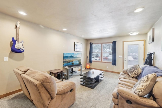 carpeted living area featuring baseboards and recessed lighting