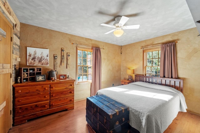 bedroom featuring ceiling fan and wood finished floors