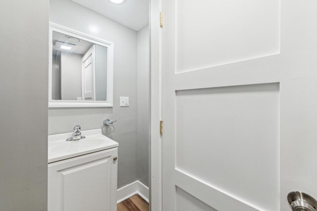 bathroom featuring vanity and wood finished floors