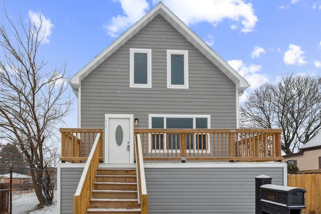 back of house with fence, stairway, and a wooden deck