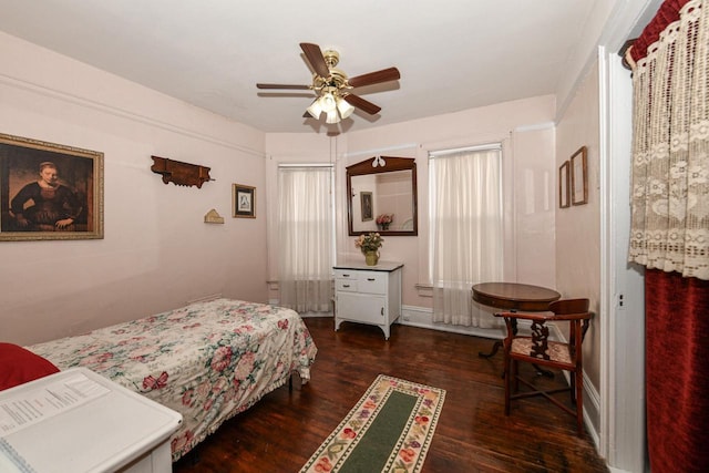 bedroom featuring dark wood-style floors and a ceiling fan