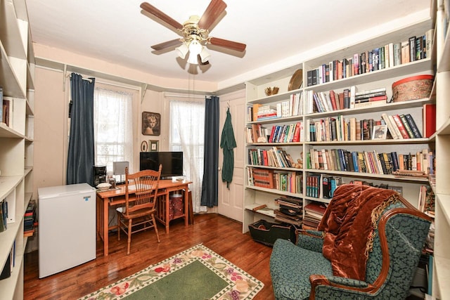 home office with ceiling fan and wood finished floors