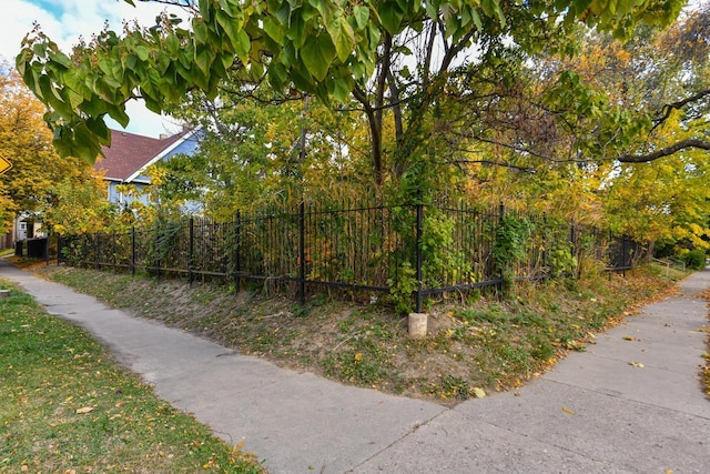 view of gate with fence