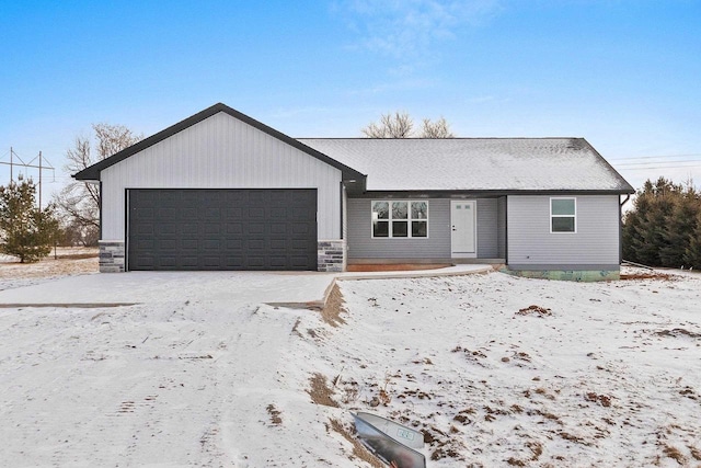 single story home featuring stone siding and an attached garage