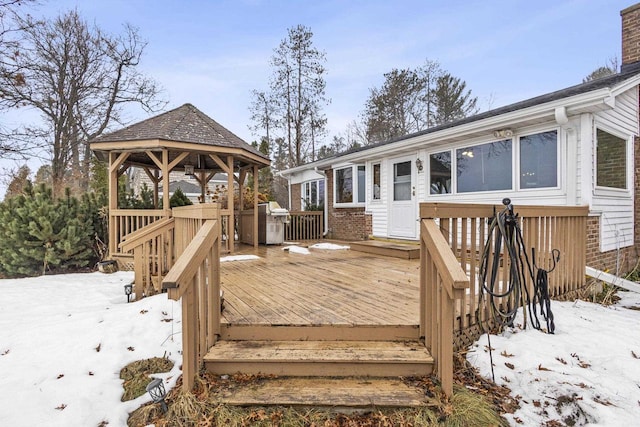 snow covered deck featuring a gazebo