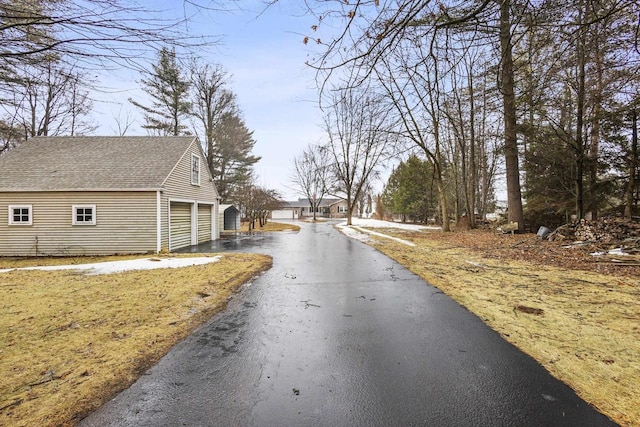 view of street with aphalt driveway