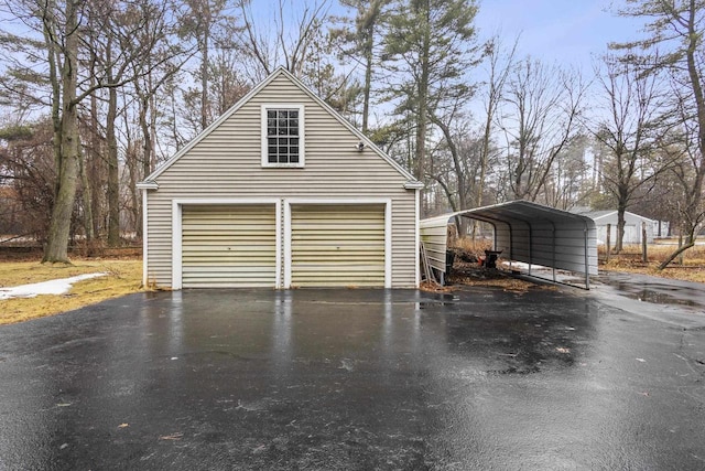 detached garage featuring a carport