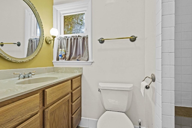 bathroom with vanity and toilet