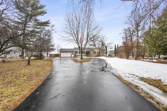 view of street with aphalt driveway