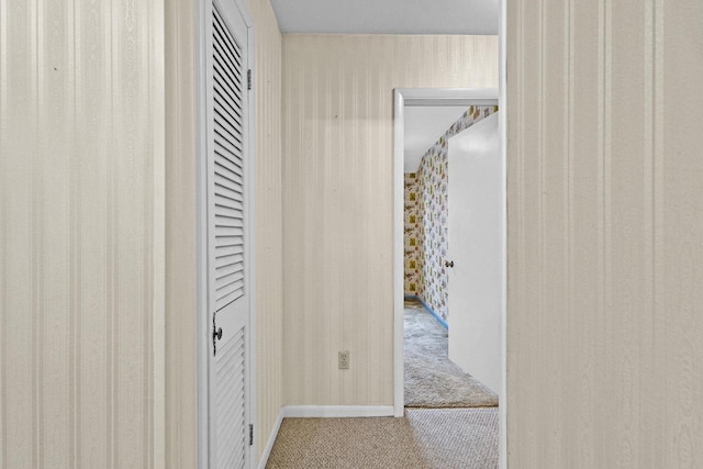 hallway featuring carpet flooring