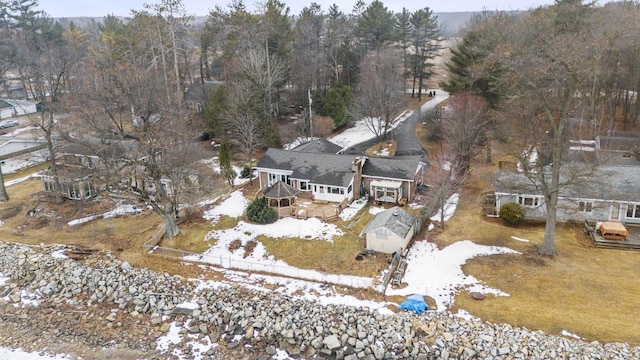 birds eye view of property with a view of trees